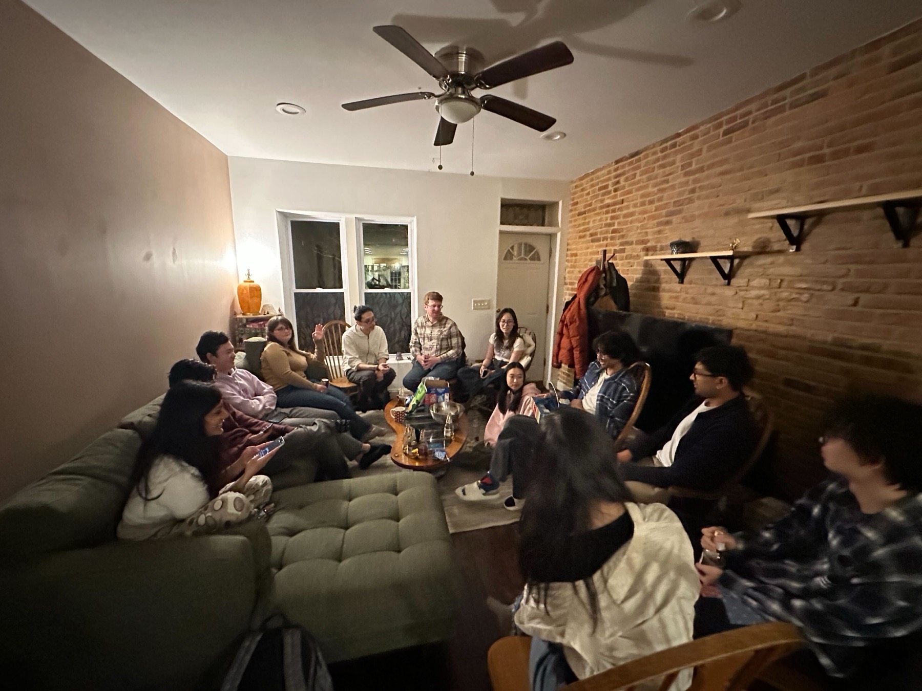 Lab members gathered in a living room.